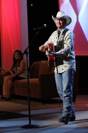 Crystal Shawanda looks on as Tracy Lawrence performs on the Crook and Chase show on RFD-TV.
Copyright Jim Owens Entertainment.
Photo by Karen Will Rogers.