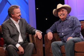 Howard Bellamy and Charlie share a laugh on the Crook and Chase show on RFD-TV. 
Copyright Jim Owens Entertainment. Photo by Karen Will Rogers.