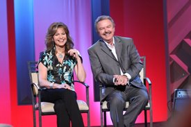 Lorianne and Charlie laugh at a clip of Charlie's old prank show, "Funny Business", on the Crook and Chase show on RFD-TV. 
Copyright Jim Owens Entertainment. Photo by Karen Will Rogers.