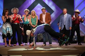 Too Slim does something that might best be described as a dancing push-up on the Crook and Chase show on RFD-TV.
Copyright Jim Owens Entertainment.
Photo by Karen Will Rogers.